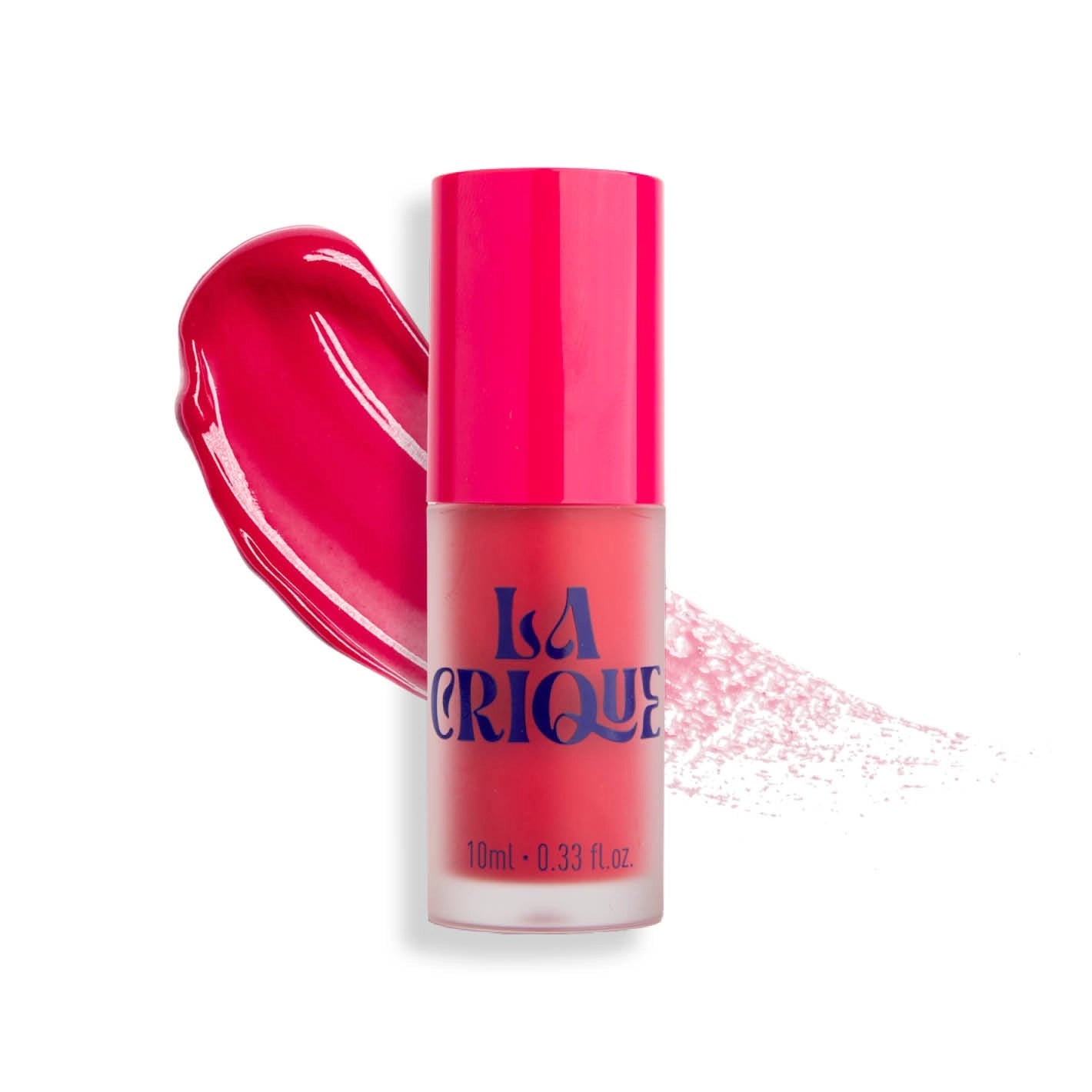 A pink bottle of Faire 04 Water Lip Balm Shade with a bright pink cap and bold blue lettering stands before a pink smear, offering a radiant matte finish for lips and cheeks.
