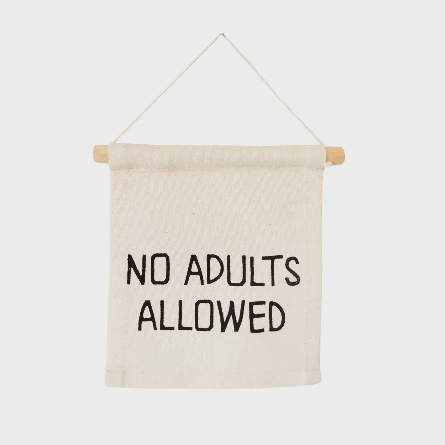 A small, handmade Canvas Hang Sign by Faire hangs from a natural poplar dowel with a string. The text on the banner reads "No Adults Allowed" in bold, black letters against a plain white background.