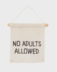 A small, handmade Canvas Hang Sign by Faire hangs from a natural poplar dowel with a string. The text on the banner reads "No Adults Allowed" in bold, black letters against a plain white background.