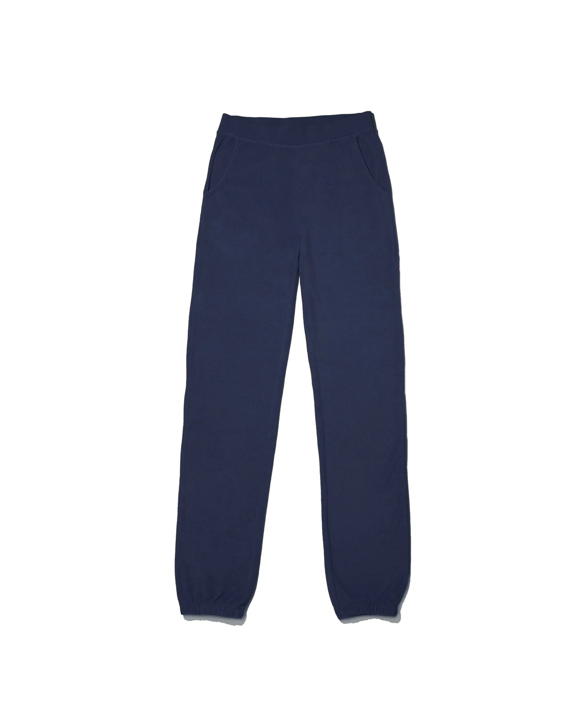 The Kule Terry Sweatpants in navy blue cotton feature an elastic waistband, side pockets, and elastic ankle cuffs, shown laid flat on a white background.