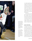 Channeling punk fashion, a person dons a white skirt with bold political patches and slogans, paired with a black jacket and boots—echoing styles found in the "Little Book Of Vivienne Westwood" by Ingram Book Company.