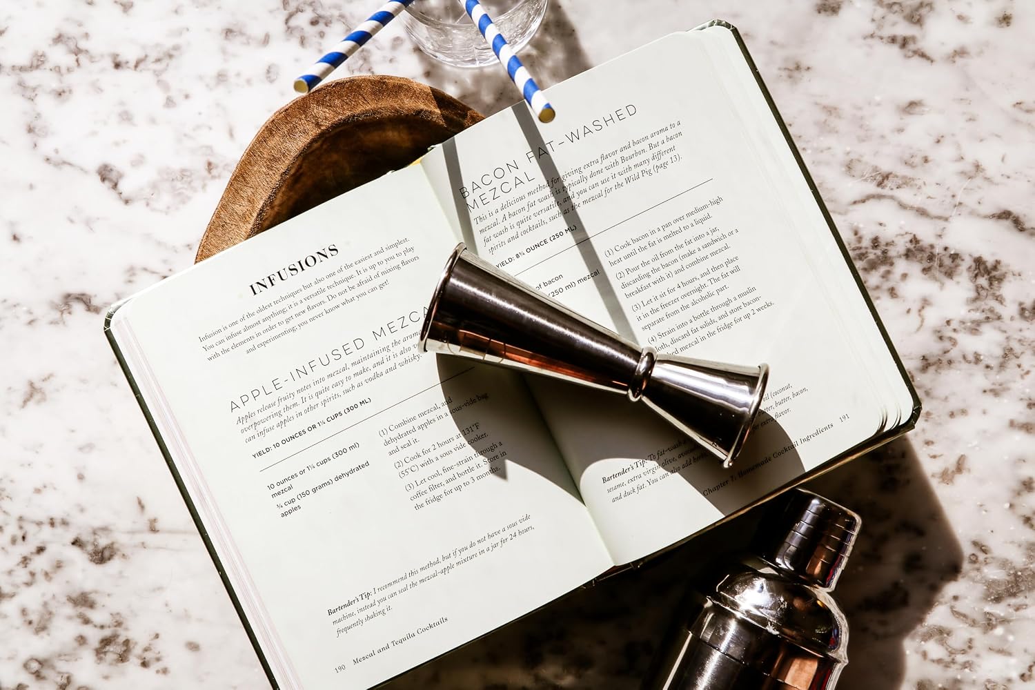 Mezcal and Tequila Cocktails book by Harper Collins with cocktail tools, styled on a bar at Bungalow Furniture &amp; Accessories.