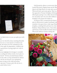The Little Book Of Vivienne Westwood by Ingram Book Company is displayed in a London shop window, alongside a bouquet with a "Thank you Vivienne" card set among flowers against a blurred city backdrop.
