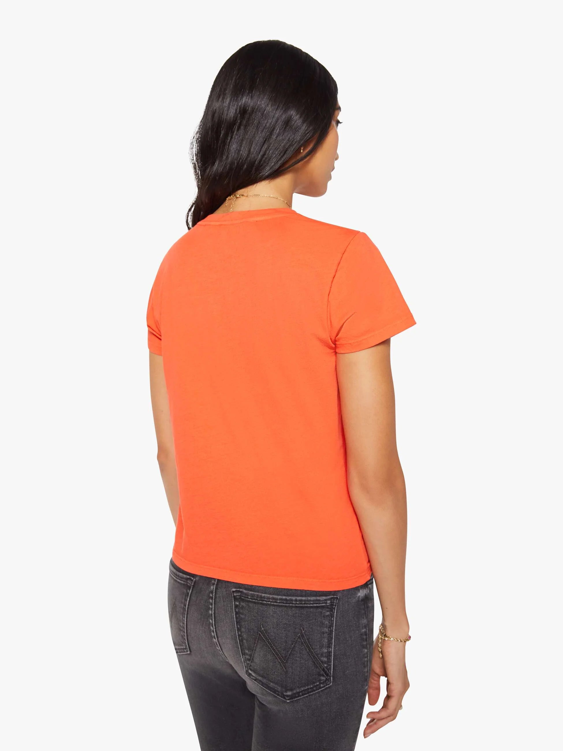Orange Mothers The Lil Goodie Goodie Tee with vintage-look jeans, back view, on plain white background.