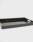 The Black Rectangular Tray by Faire showcases exquisite resin craftsmanship with a glossy finish and gold-trimmed edges. This sophisticated piece is designed with cut-out handles on both sides and is beautifully highlighted against a plain white backdrop.