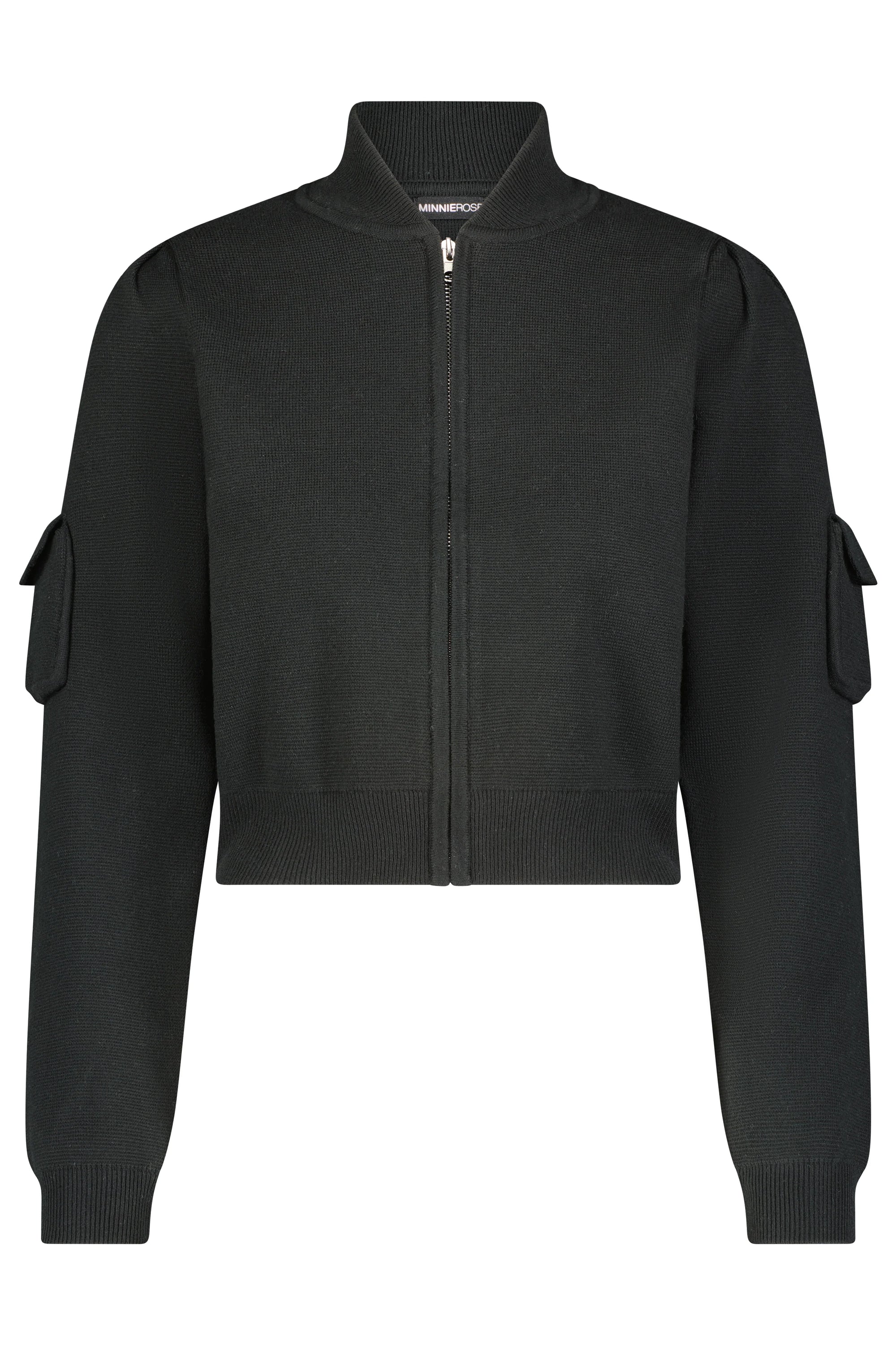 Introducing the Cropped Bomber Jacket by Minnie Rose: A sophisticated black zip-front jacket made from a luxurious cotton blend. It features a ribbed collar, cuffs, and hem, complemented by stylish puffed sleeves and flap pockets on each arm. This versatile layering piece presents a sleek, minimalist design perfect for any wardrobe.