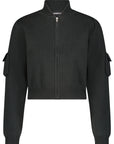 Introducing the Cropped Bomber Jacket by Minnie Rose: A sophisticated black zip-front jacket made from a luxurious cotton blend. It features a ribbed collar, cuffs, and hem, complemented by stylish puffed sleeves and flap pockets on each arm. This versatile layering piece presents a sleek, minimalist design perfect for any wardrobe.