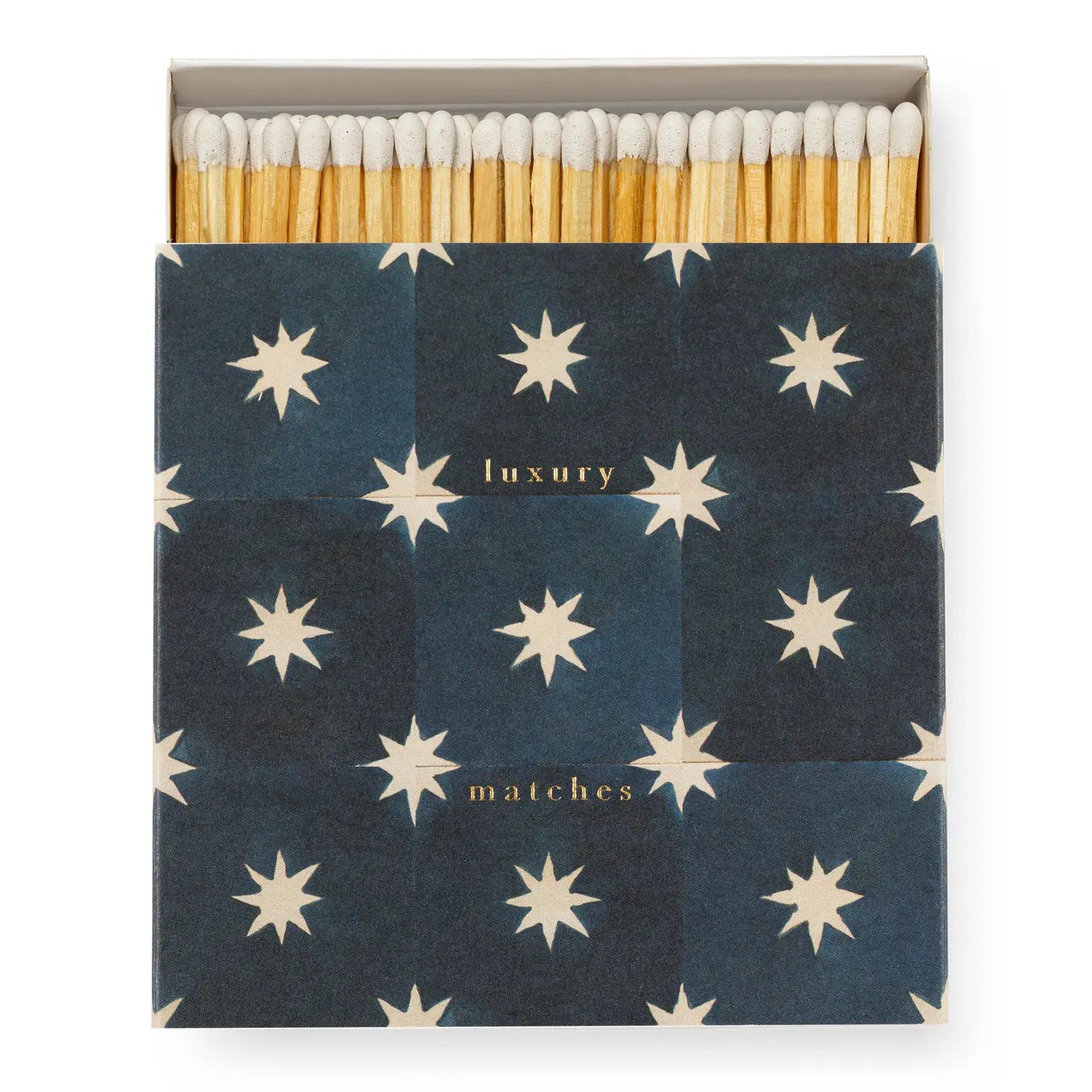 Faire's Matches/Square features an open box of white-tipped matches with a dark blue cover adorned with white stars and "luxury matches" in gold—an eye-catching example of matchbox design.