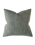 The Eastern Accents ROWLEY WOVEN TEAL pillow features a textured blue-gray velvet fabric with a subtle woven pattern, adding elegance to any decor; shown against a white background.