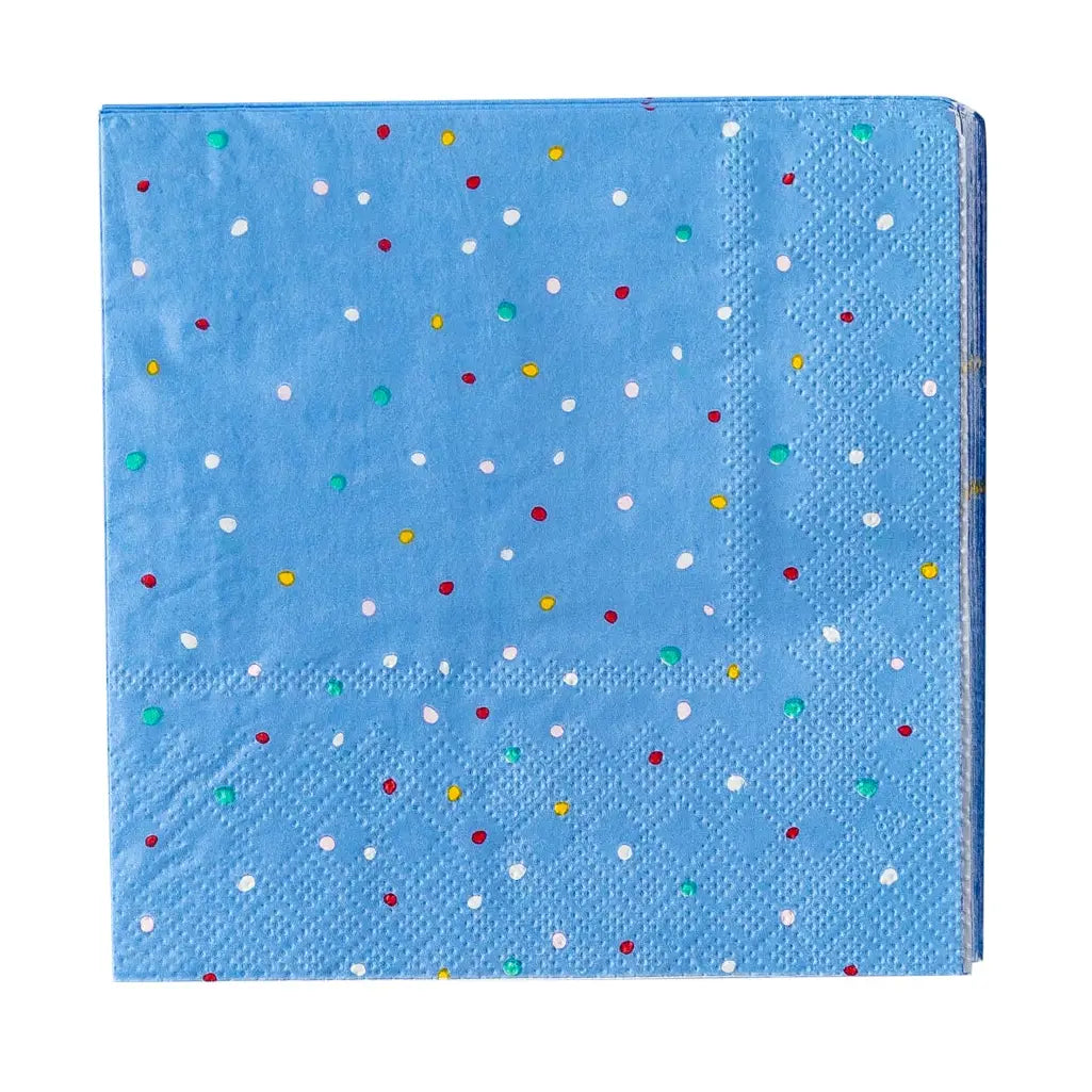 The Faire MME Napkin is a blue paper napkin with red, white, yellow, and green polka dots and a textured border, neatly folded into a square—ideal for festive gatherings or as cheerful holiday dinner decor.