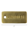 The HomArt Brass Tag is a 2"x1" rectangular hand-stamped brass tag engraved with "CONGRATS" and a hole on the left—ideal as a unique personalized gift or gift tag for any celebration.
