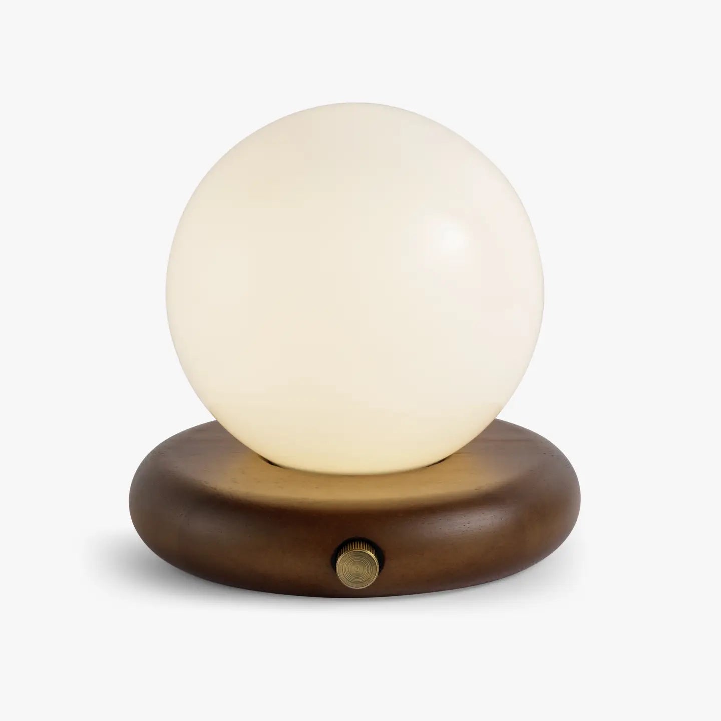 The Valencia Portable Light by Faire features a round frosted glass shade atop an oval wooden base with a metal knob, set against a plain white background.