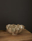 Caraway Bowl with wavy edges by Accent Decor on a wooden table, dark background, modern decorative accent.