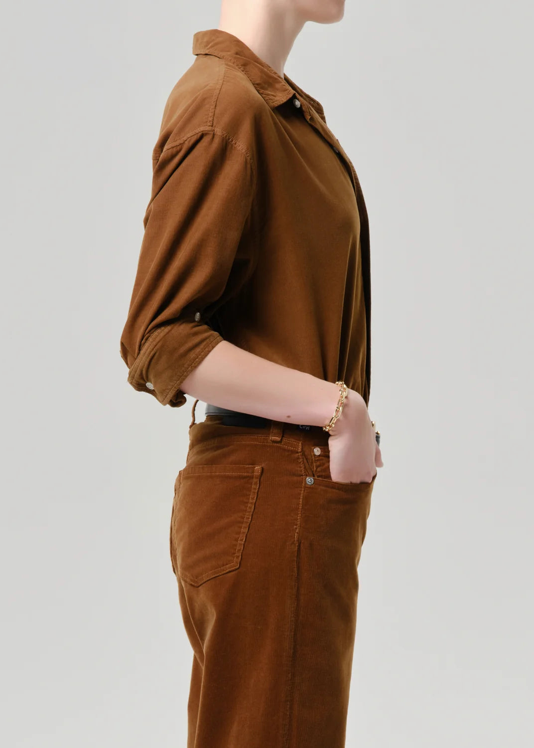 Kayla corduroy shirt by Citizens Of Humanity/AGOLDE shown in profile with hand in pocket, casual look.