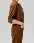 Kayla corduroy shirt by Citizens Of Humanity/AGOLDE shown in profile with hand in pocket, casual look.