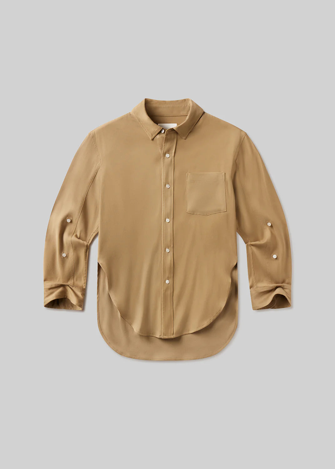The kayla shirt in portofino twill by Citizens Of Humanity/AGOLDE features a relaxed fit, long sleeves, chest pocket, curved hem, button front, and classic collar in tan Italian twill, shown laid flat on a light gray background.