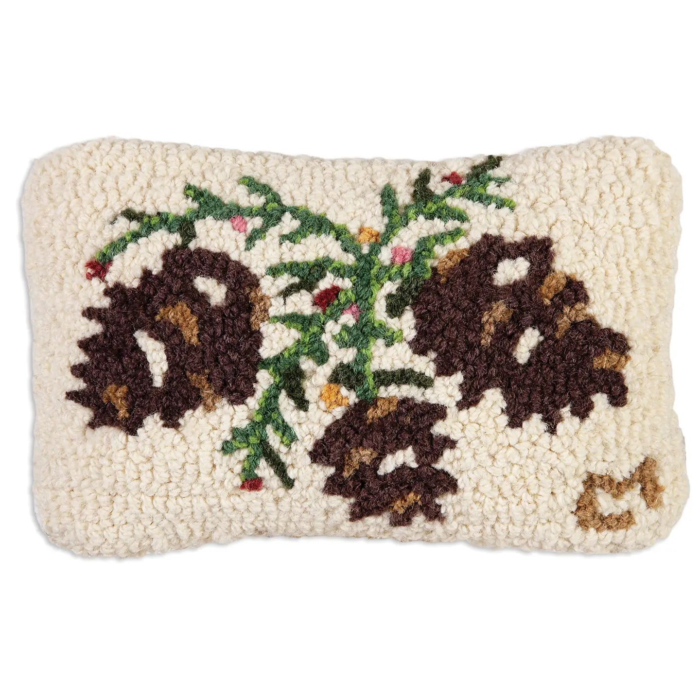 The Faire Christmas Mini Pillows are rectangular, cream-colored pillows hand hooked from natural wool, featuring three brown pinecones with green needles and red accents for a cozy, rustic look.