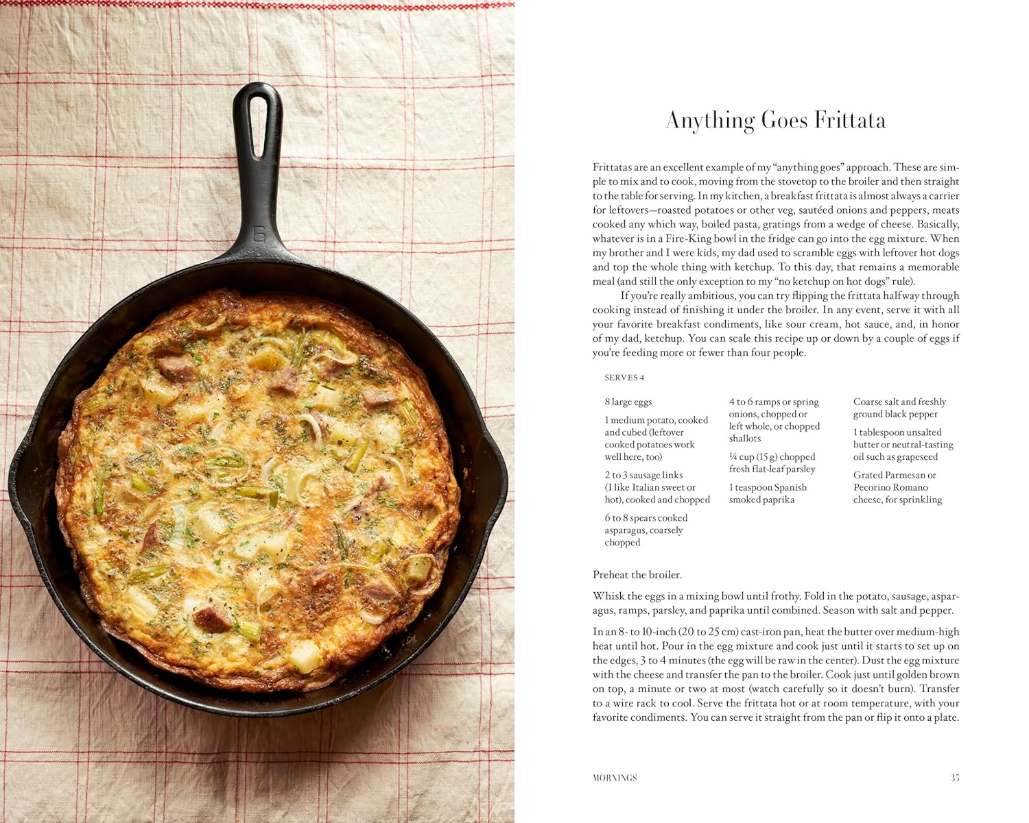 A golden-brown frittata in a black cast-iron skillet rests on a red grid-patterned cloth, its top dotted with potatoes and vegetables—an inviting dish worthy of A Man & His Kitchen by Hachette Book Group.