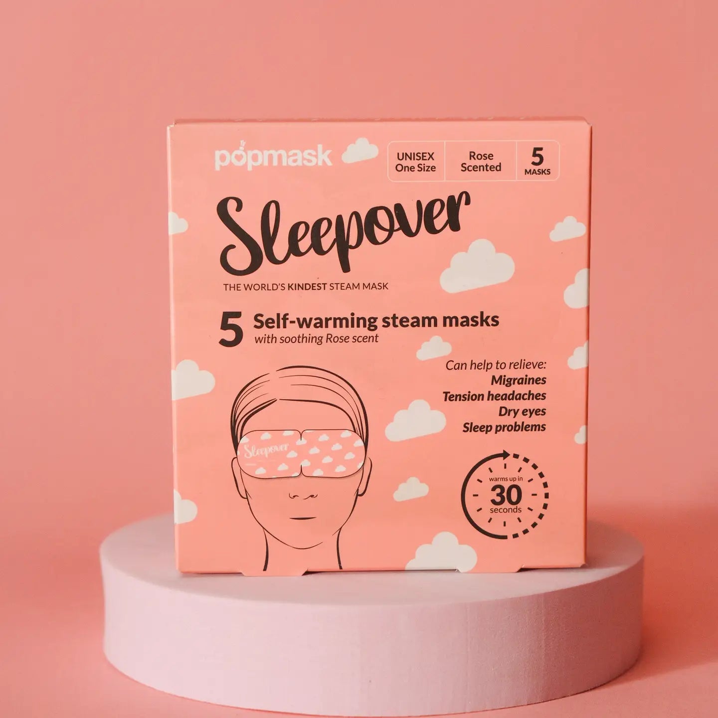 A pink box of Faire Popmask Sleepover self-warming steam masks with a rose scent offers relief for migraines, tension headaches, and dry eyes. It includes 5 unisex masks designed for 30 minutes of relaxation.