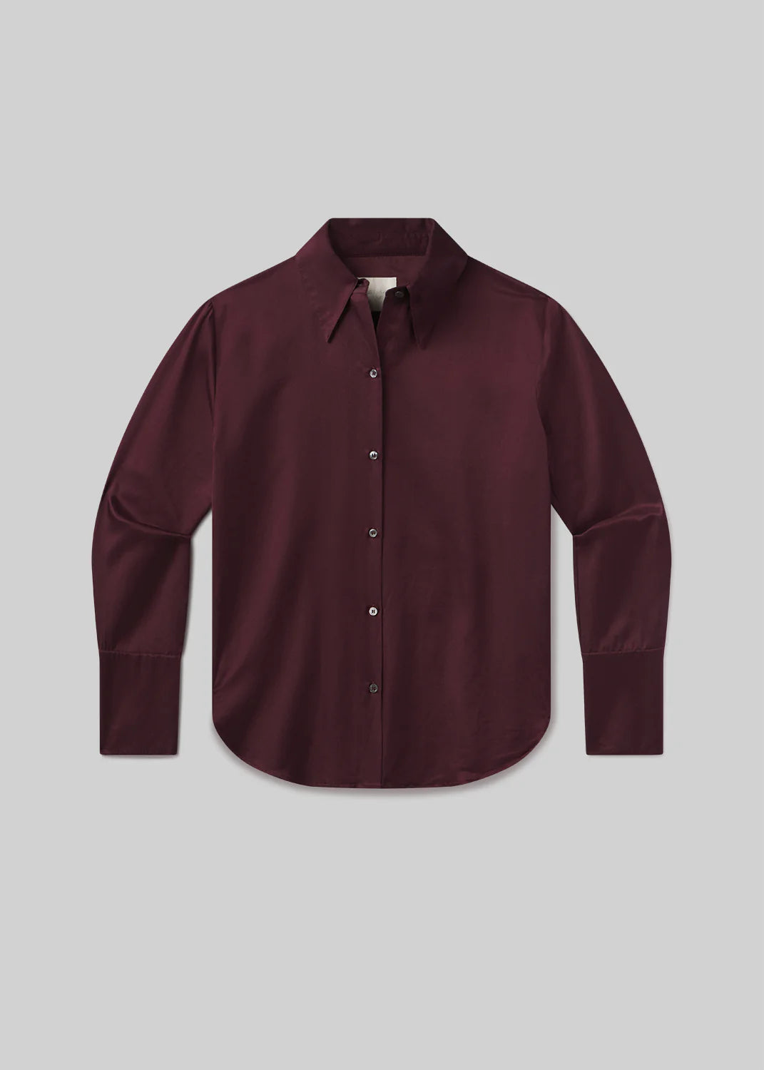 The Camilia Shirt by Citizens Of Humanity/AGOLDE is a deep burgundy, long sleeve button-front blouse with a classic collar and buttoned cuffs, shown flat on a light gray background for a timeless look.