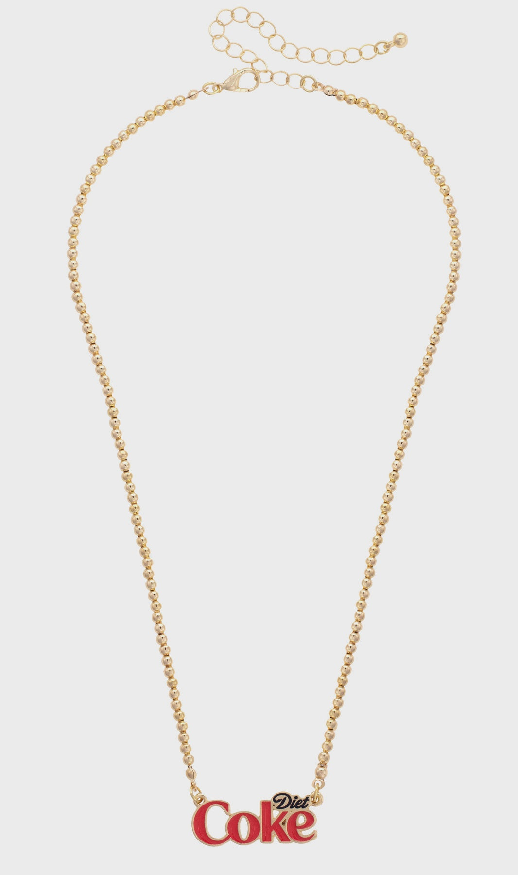 The Faire Coca-Cola Necklace features a gold-tone ball bead chain and an adjustable clasp, highlighted by a bold "Diet Coke" charm in red and black. Enjoy easy adjustment for the perfect fit.