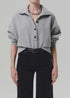 Heather grey Mirelle Funnel Neck sweater by Citizens of Humanity, styled with black pants and silver accessories.