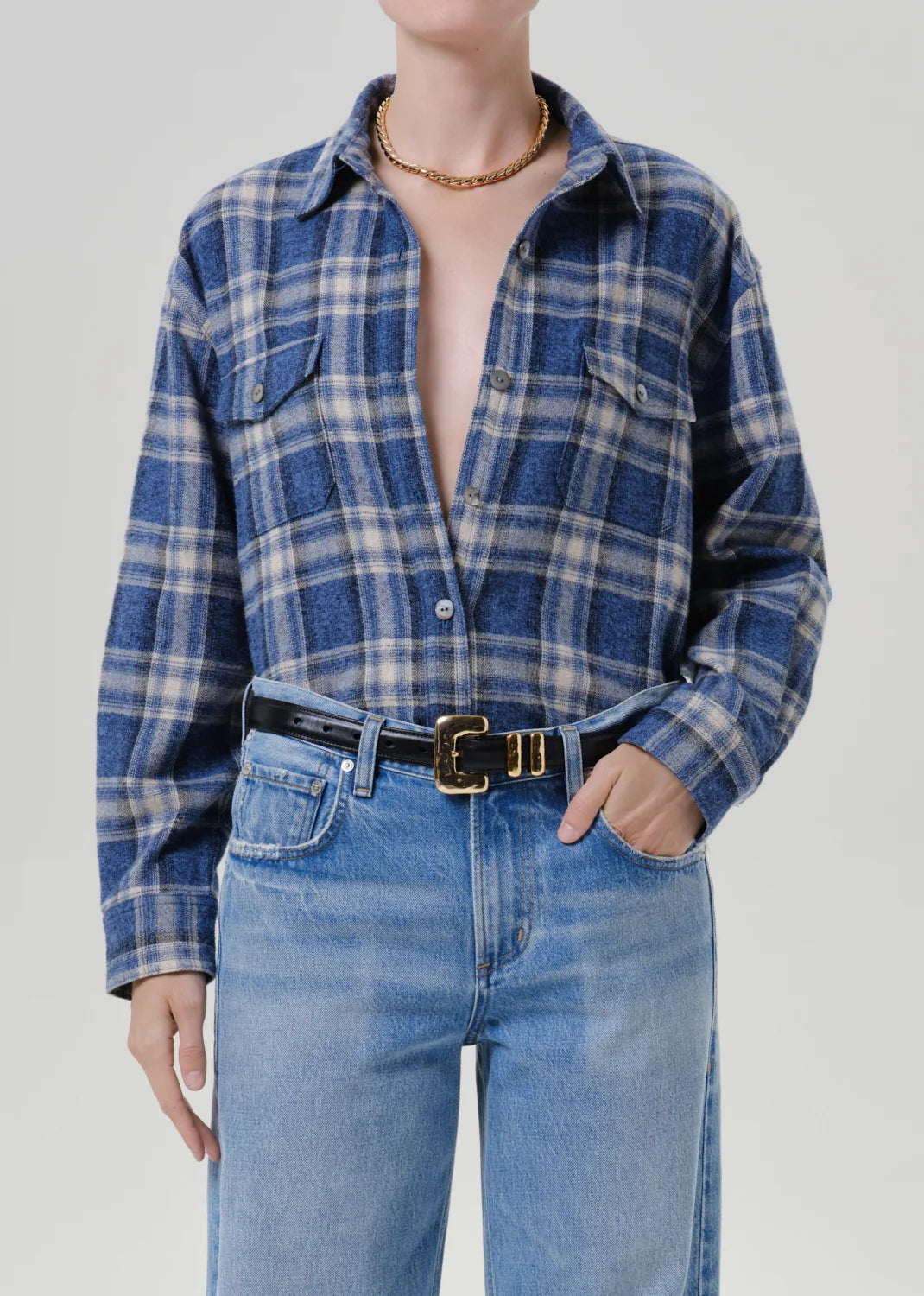 Citizens Of Humanity vintage marina plaid shirt in blue tones, styled with light jeans and a gold chain necklace.