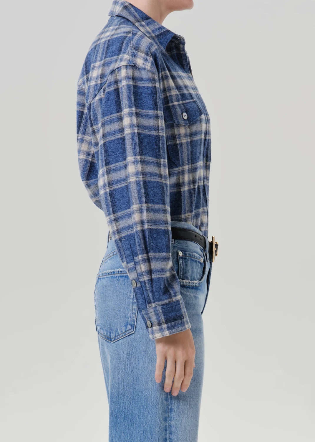 Marina plaid vintage long button up shirt by Citizens Of Humanity/AGOLDE with light blue jeans, side view.