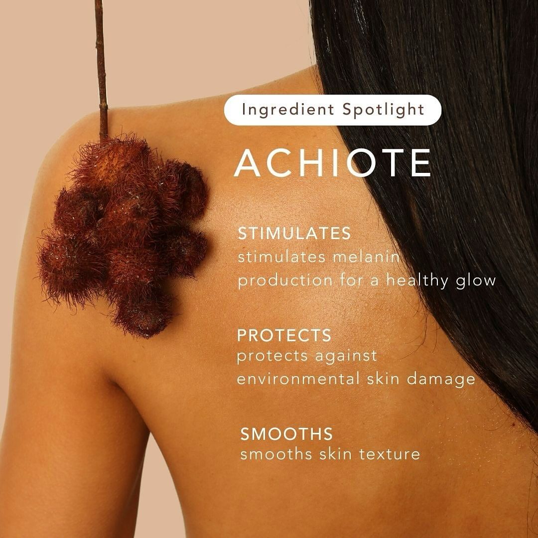 A person with smooth, tan skin and long dark hair faces away, showing a bare shoulder as a reddish-brown achiote seed pod hangs above. Text highlights Rahua Enchanted Island Body Glow Wash by Faire: boosts collagen, protects and smooths skin.