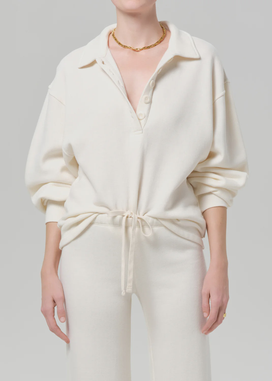 Off-white collared top and matching high-waisted wide-leg pants by Citizens Of Humanity/AGOLDE, vintage style set.