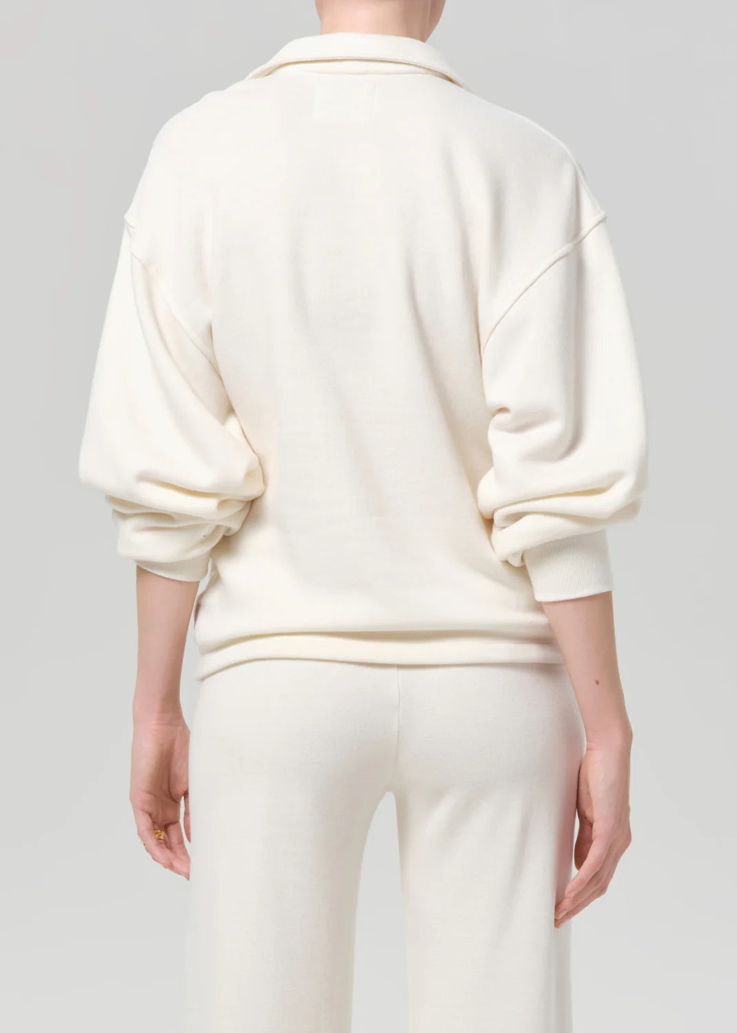 Back view of vintage Citizens Of Humanity polo and pants with cozy brushed interior, casual style.
