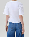 Rework mens tee by Citizens Of Humanity/AGOLDE in black, back view, styled with blue jeans on gray background.
