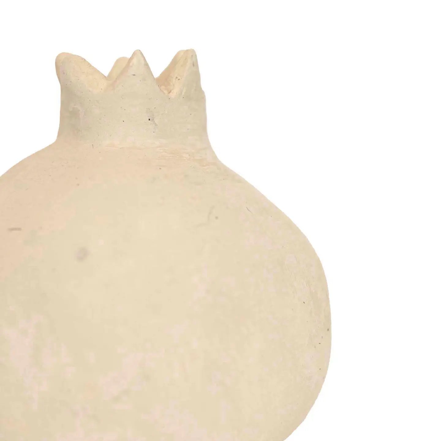 A close-up of the Turner Pomegranate by Faire, a beige ceramic ornament with a textured surface and crown-shaped top, ideal for rustic home decor, set against a plain white background.