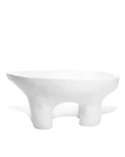 The 4846 Bowl No.846 by Montes Doggett is a modern, minimalist white ceramic bowl featuring three short, rounded legs that support a shallow basin. Crafted by Peruvian artisans, this bowl boasts an irregular, organic shape with smooth, clean lines and a matte finish.