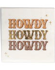 The MME Napkin by Faire is a decorative square paper napkin showcasing the word "HOWDY" repeated three times in shimmering metallic gold, silver, and bronze colors. It features small star-like designs scattered around the text on a pristine white background.