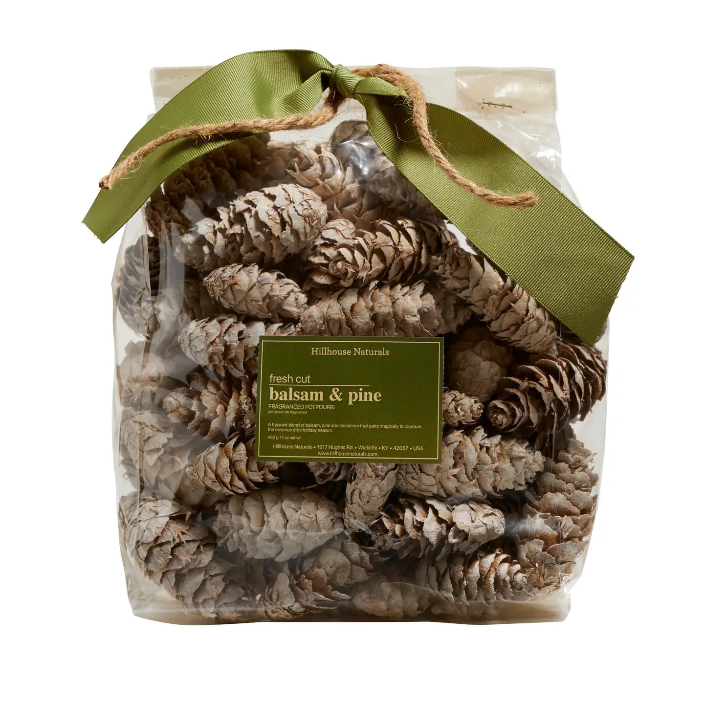 A clear plastic bag of Potpourri from Faire, filled with pine cones and tied with a green ribbon and twine. The label reads "fresh cut balsam & pine"—the perfect Christmas scent to pair with holiday candles.