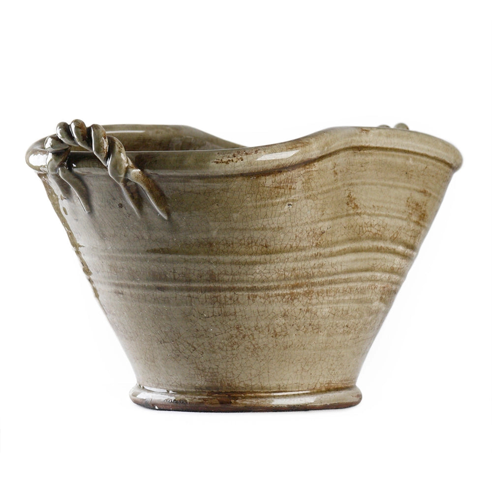The Zentique Grey Ceramic Pot features a handcrafted design with a wavy rim, twisted decorative handle, subtle horizontal lines, and an uneven organic shape for a unique look.