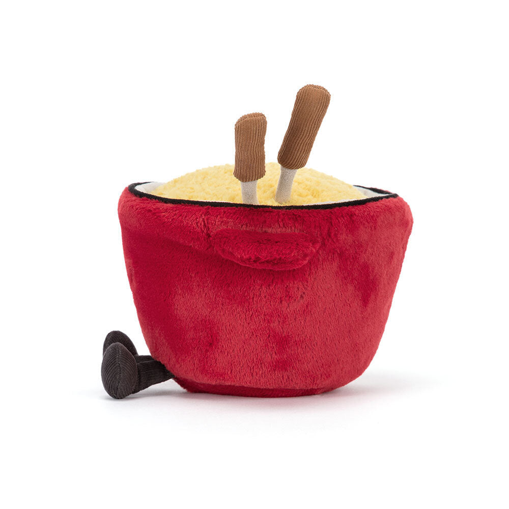 The Amuseables Cheese Fondue by Jelly Cat Inc. is a plush toy shaped like a red pot with yellow "cheese," brown chopsticks, and a black handle—perfect for adding Swiss-inspired fun to dinner parties.