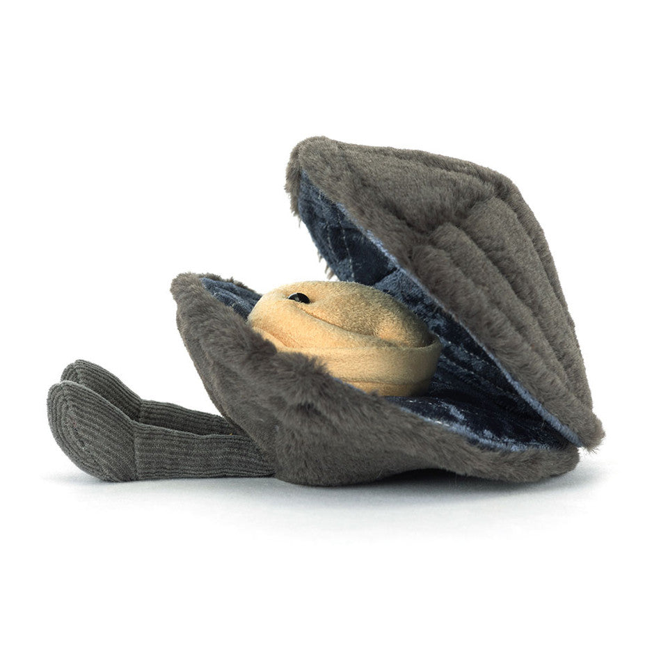 Amuseables Michelle Mussel by Jelly Cat Inc. is a plush toy shaped like a gray clam with a smiling, pearl-like face and two soft flipper-like feet, shown against a white background.