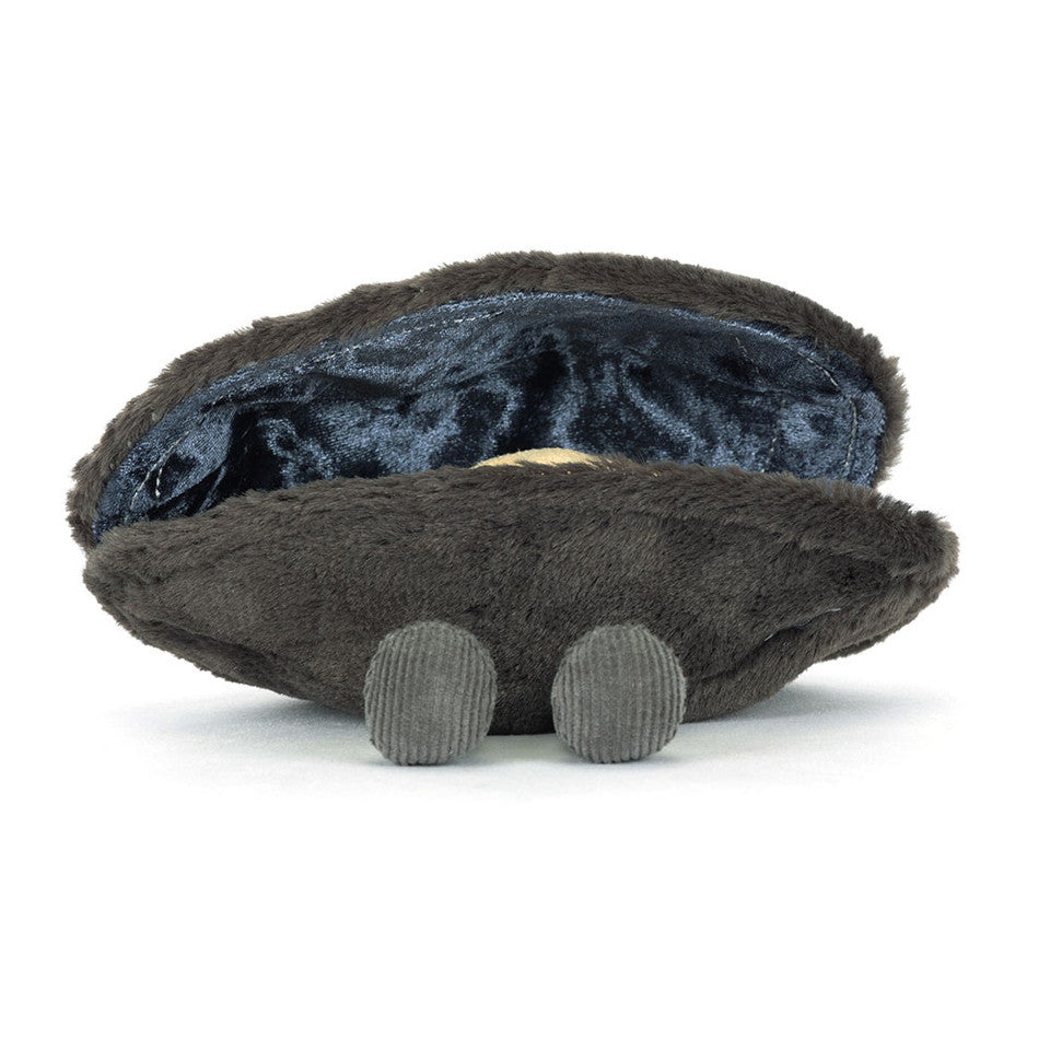 The Amuseables Michelle Mussel by Jelly Cat Inc. is a plush toy shaped like a dark gray clam with a velvety interior and two small, ridged feet, shown on a white background.