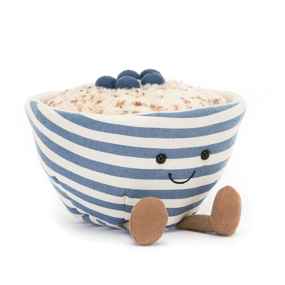 The Amuseables Oats by Jelly Cat Inc. is an adorable plush toy designed to resemble a blue and white striped bowl of oatmeal topped with blueberries. This cute and playful character features a smiling face and brown legs.