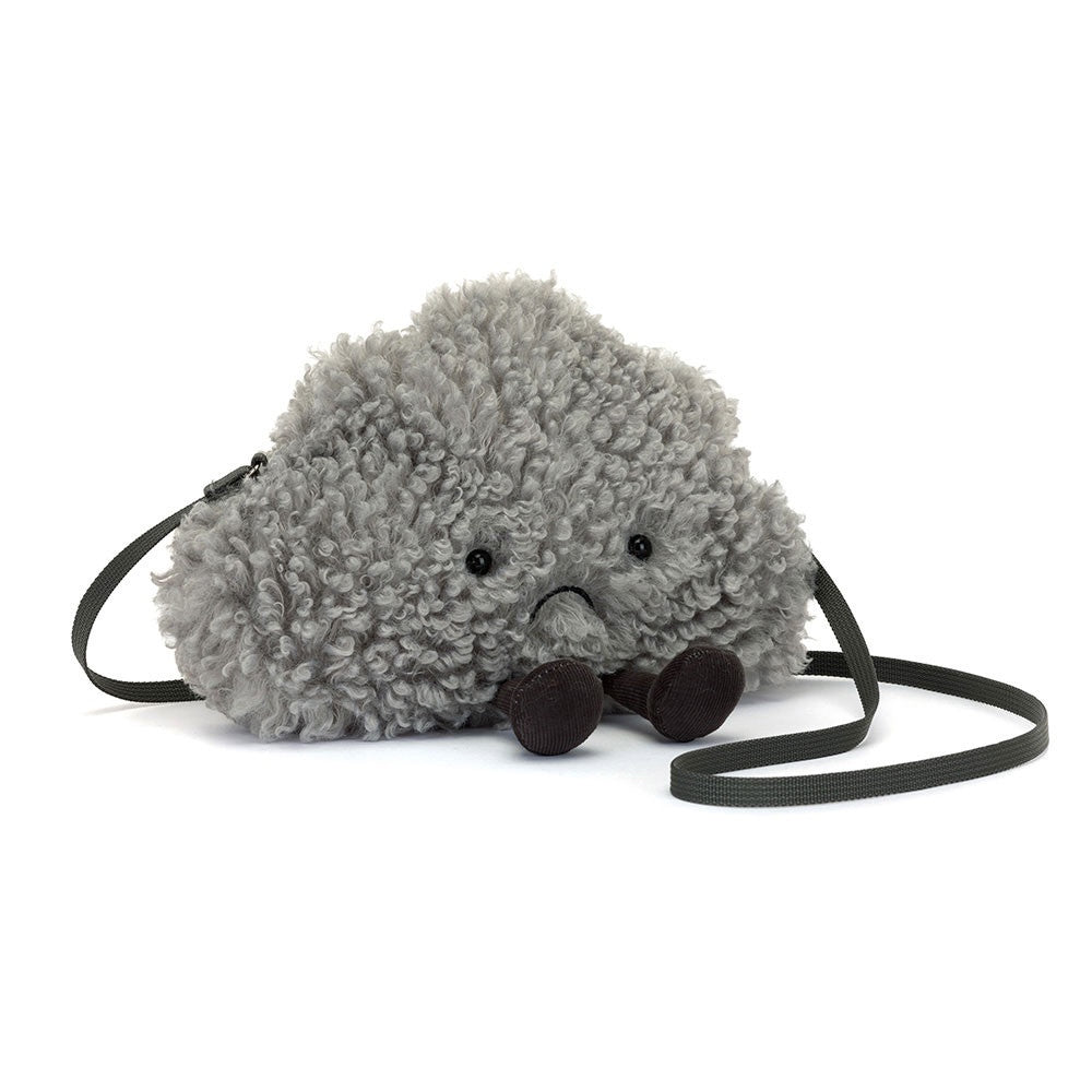 Introducing the Amuseables Storm Cloud by Jelly Cat Inc., a plush bag resembling a fluffy gray cloud with textured fur and small black eyes in a sad expression. It boasts dangling black legs, a hidden zip closure, and a thin dark strap for easy carrying.