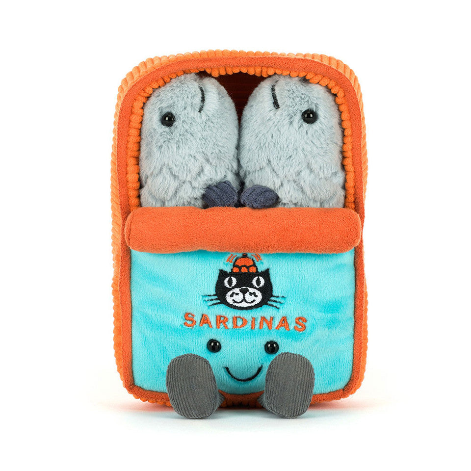 The Amuseables Sardine Tin plush by Jelly Cat Inc. features a blue and orange sardine tin with "SARDINAS" and an embroidered cat on the front, plus two smiling grey sardine plushies inside.