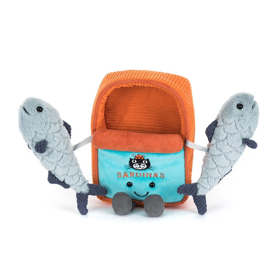 The Amuseables Sardine Tin by Jelly Cat Inc. is an orange and blue plush with "Sardinas" embroidered, a smiling face, and two soft gray sardines peeking out—perfect for any quirky plush collection.