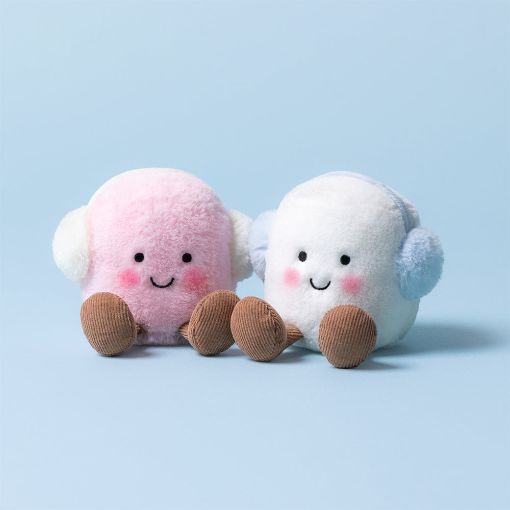 Two plush Amuseables Toastie Pink and White Marshmallows by Jelly Cat Inc., with rosy cheeks, brown corduroy feet, and matching earmuffs, sit side by side on a light blue background—perfect winter companions.