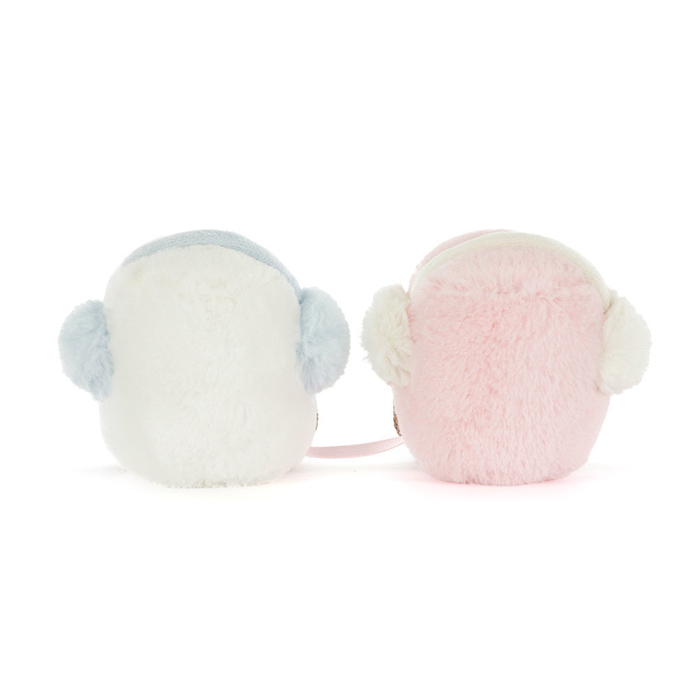 The Amuseables Toastie Pink and White Marshmallows by Jelly Cat Inc. sit side by side, each with playful ear muffs, creating a cozy winter accent that's perfect for gifting.