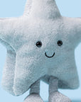 The Amuseables Silver Star by Jelly Cat Inc. is a soft plush toy featuring a smiling face, black button eyes, and glittery silver legs—perfect for any dreamer and displayed against a light blue background.