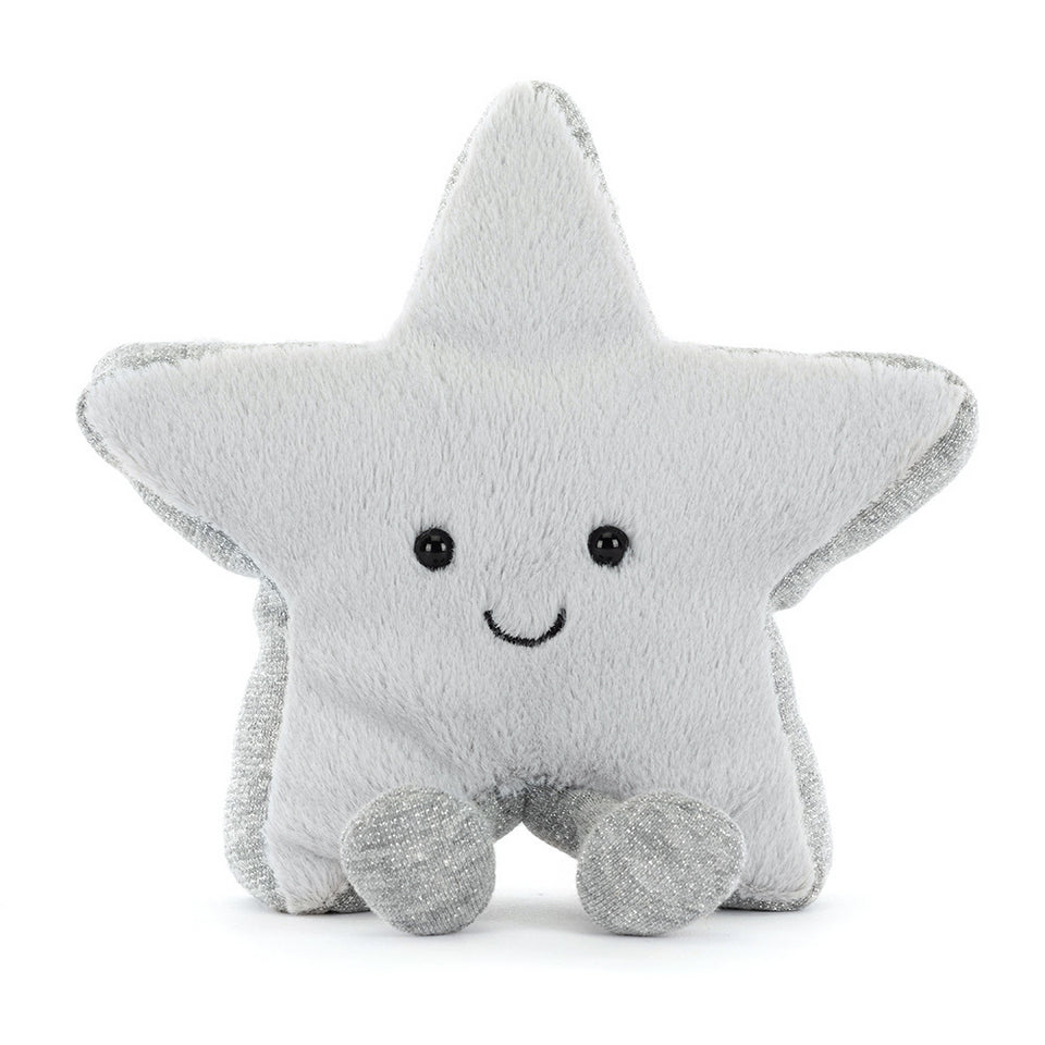 The Amuseables Silver Star by Jelly Cat Inc. is a plush toy with a soft light gray body, shiny silver edges, small silver feet, black button eyes, and a stitched smile, shown sitting upright on a white background.