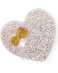 The Sugarboo Designs DIY Friendship Jewelry Kit includes a heart-shaped container with compartments filled with white letter beads and a spool of gold string, ideal for crafting personalized bracelets and necklaces.