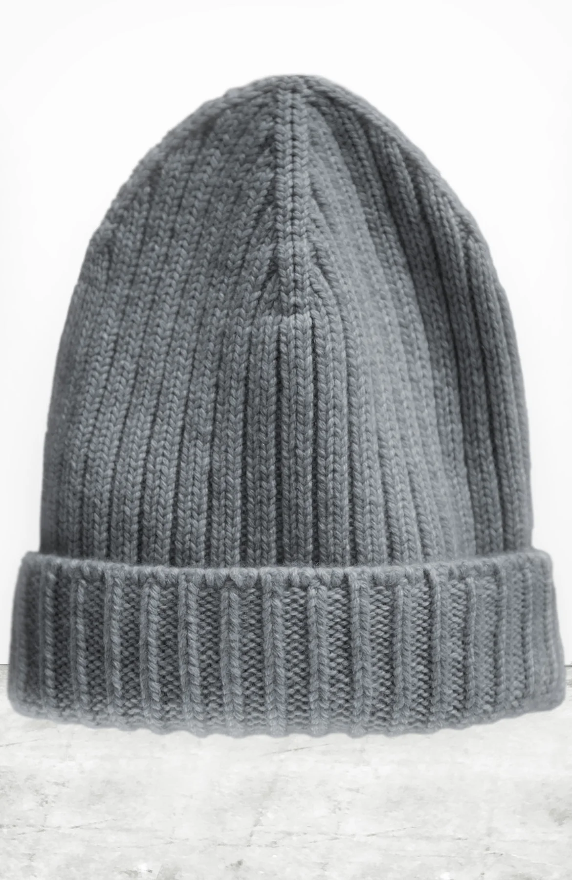 The Loro Piana Cashmere Beanie by Free City (sparrow, LLC) is a gray knitted unisex beanie with a folded brim, shown upright against a plain white background.